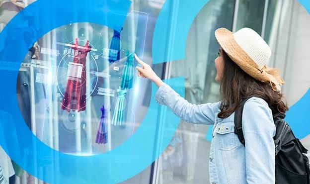 Woman leveraging digital display technology for real-time consumer engagement and planning insights.