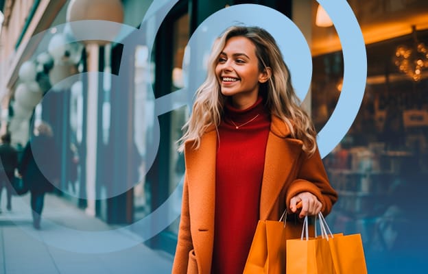 Woman with Orange Shopping Bags and Coat Smiling
