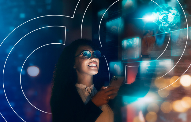 Woman interacting with a futuristic digital interface displaying holographic screens and a glowing globe, holding a smartphone, and smiling